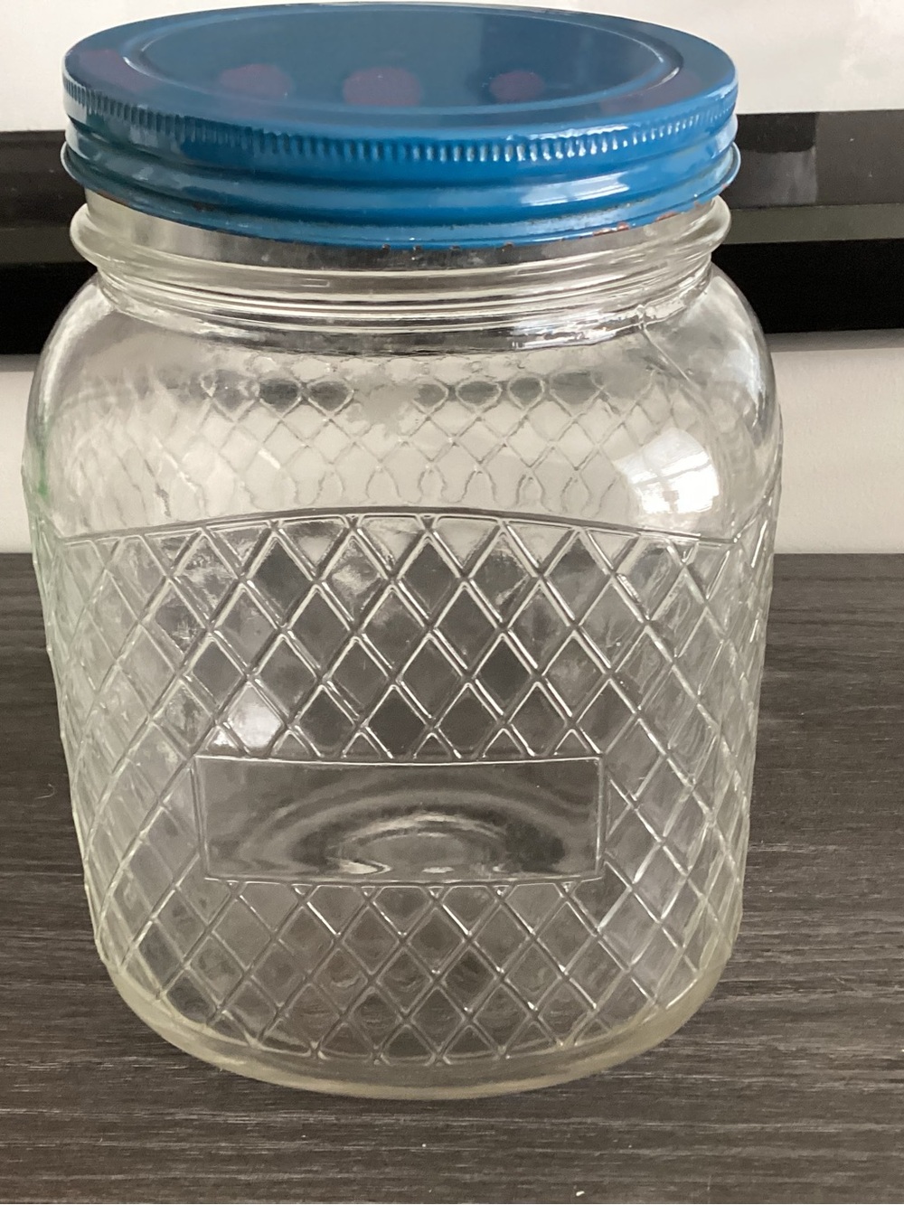 Antique  Large glass jar with pretty color blue lid.  From the 1920s COLLECTABLE